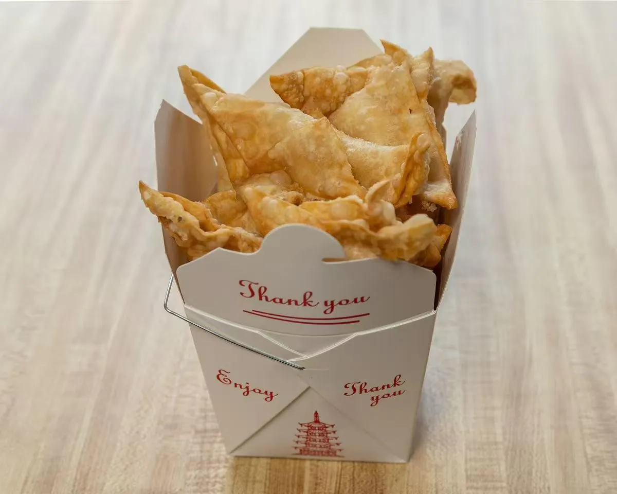 Crispy golden fries served in a paper container at Wah Sang Restaurant, a Chinese Restaurant in Methuen