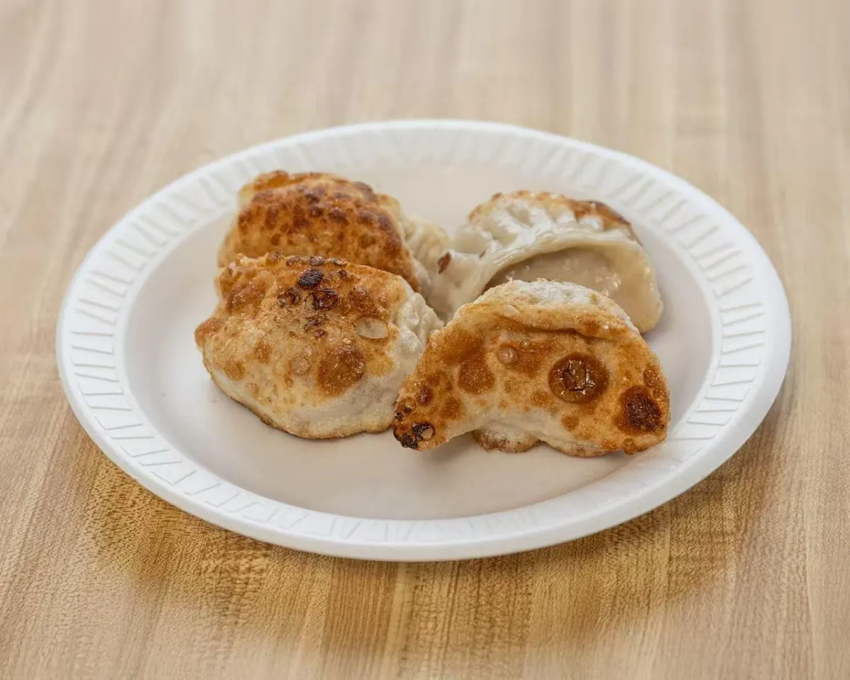 Golden pan-fried dumplings with crispy bottoms at Wah Sang Restaurant, a Chinese Restaurant in Methuen
